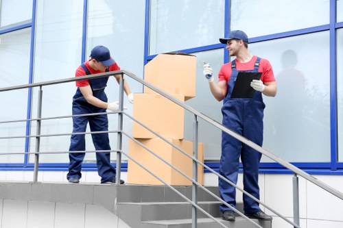 Professional movers handling furniture in South East London