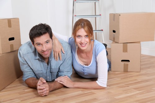 Team of furniture removers handling items with care